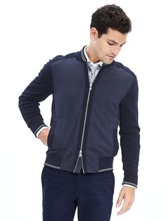 Navy Knit Baseball Jacket Sporty Outerwear With Pockets And Baseball Collar, Spring Sporty Varsity Jacket With Zipper Closure, Spring Sporty Varsity Jacket With Zipper, Sporty Spring Varsity Jacket With Zipper Closure, Sporty Varsity Jacket With Zipper For Spring, Sporty Spring Varsity Jacket With Zipper, Casual Long Sleeve Varsity Jacket With Zipper, Varsity Jacket With Pockets For Workwear, Varsity Workwear Jacket With Pockets