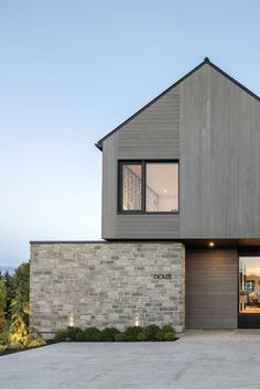 a modern house with an open garage door