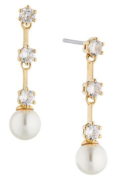 "Find NADRI Olivia Linear Drop Earrings on Editorialist. A line of prong-set cubic zirconia trickles down to a luminous imitation pearl in these hand-polished drop earrings that exude contemporary elegance. 1\" drop; 1/4\" width; 6mm pearls Rhodium plate or goldtone plate/cubic zirconia/imitation pearl Imported" Earrings In Gold, Gold Drop Earrings, Prong Setting, Rhodium Plated, Gold Earrings, Cubic Zirconia, Gold Tones, A Line, Jewelry Earrings