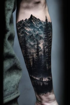 a man's arm with mountains and trees on it