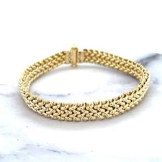 ➣ High quality 14K Yellow Gold Thick 7" Mesh Woven Bracelet, 8.8mm 14.5mm Wide, Braided Bracelet, Fancy Bracelet, Real Gold Bracelet, Women ➣ MATERIAL: 14K Yellow Gold  ➣ Closure: Box   ➣ Weights:  7" -  8.8mm - 11.60 gram 7"  - 14.50mm  - 19.10 gram ◈ Please note that weights are approximate. ➣ If you need a specific length, please message us. Explore more gold bracelets. https://www.etsy.com/shop/MarinaMJewelry?ref=seller-platform-mcnav&search_query=gold+bracelet ➣ SHIPPING: ◈ We always offer Gold Bracelet Women, Bracelet Fancy, Real Gold Bracelet, Fancy Bracelet, Woven Bracelet, Gold Bracelets, Braided Bracelet, Bracelet Women