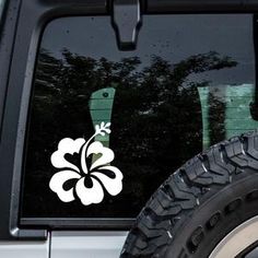 a white flower sticker on the side of a car