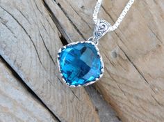 "Two London blue topaz necklaces...1 1/8\" tall with bail by 5/8\" wide at the widest spot, cast in sterling silver 925 with a beautiful 14mm by 14mm cushion cut London blue topaz stone...the chain is 18\" with a lobster catch also in sterling silver 925..regular price for one necklace $86.00 sale price $70.52" Silver Topaz Cushion Cut Jewelry, Blue Cushion Cut Sterling Silver Jewelry, Sterling Silver Cushion Cut Necklace, Silver Blue Topaz Cushion Cut Jewelry, Cushion Cut Sapphire Sterling Silver Jewelry, Cushion Cut Sapphire Jewelry In Sterling Silver, London Blue Topaz Necklace, Blue Topaz Necklace, Topaz Necklace