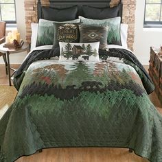 a bed with a green comforter and pillows