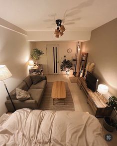 a living room filled with furniture and a flat screen tv