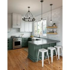 a kitchen with an island and three stools