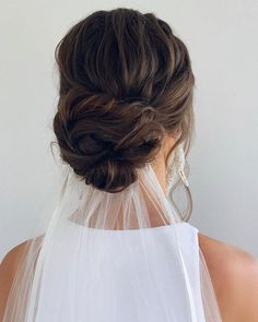 the back of a woman's head wearing a veil