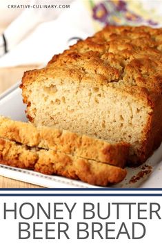 a loaf of honey butter beer bread on a plate