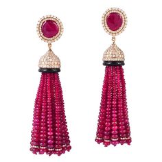 These stunning exceptional tassel earrings is handmade in 18-karat gold. It is set with 116.9 carats ruby and 4.722 carats of glittering diamonds. FOLLOW MEGHNA JEWELS storefront to view the latest collection & exclusive pieces. Meghna Jewels is proudly rated as a Top Seller on 1stDibs with 5 star customer reviews. All items manufactured by us are handmade and can be customized or redesigned. Composition Size-76X15 MM Total Weight-38.7804 Gold Weight(Gms)-13.898 Diamond Wt(Cts)-4.722 Ruby Wt(Cts)-116.9 Gold Tassel Earrings, Beaded Tassel Earrings, Ruby Beads, Harry Winston, Tassel Drop Earrings, Diamond Glitter, Statement Drop Earrings, Gold Chandelier, Pearl Earrings Dangle