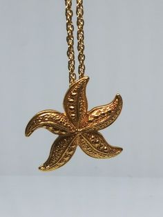 Starfish necklace. 30 inch chain Gold Jewelry With Starfish Charm For Gift, Gold Jewelry With Starfish Charm As A Gift, Starfish Nickel-free Necklace As Gift, Gold Starfish Charm Jewelry, Gold Starfish Charm Necklace Gift, Nickel-free Starfish Necklace For Gift, Gold Necklace With Starfish Charm For Gift, Gold Starfish Necklace With Lobster Clasp, Gold Charm Necklaces With Starfish Charm As A Gift