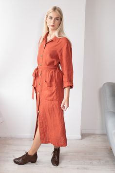 "Simple oversize long linen coat-dress made from washed Lithuanian eco-certified soft linen. Shirt collar, front fastening with coconuts buttons, big pockets and long belt. Perfect for every day wear in summer and autumns days, will protect you in windy and sunny day. Jacket center back length - 122 cm (48\"). Model of size S wears coat in terracotta color linen size S This item is machine washable with gentle detergents and no bleachers, use delicate drying and if needed iron while damp. After Long Linen Shirt Dress For Spring, Spring Linen Long Shirt Dress, Spring Long Linen Shirt Dress, Long Fall Shirt Dress With Pockets, Long Shirt Dress With Pockets For Fall, Relaxed Fit Linen Dress With Button Closure For Work, Linen Shirt Dress With Buttons For Fall, Linen Shirt Dress With Button Closure For Fall, Linen Dress With Pockets For Workwear