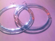 Extra Large Hoop Earrings, Huge Sparkly Party Hoops, 4 Inch Laser Cut Clear Acrylic Festival Hoops, Funky Extravagant Disco Glitter Hoops --Materials: laser cut plexiglass bases, glitter high quality resin, Hooks ~> you can choose material Brass OR Sterling Silver --Dimension: 10 cm (4 in) x 12 cm length (4.7 in) These lovelies are so lightweight--> you are going to forget you are wearing them! Firstly, i come up with the design, making some quick sketches, I then design them in my laptop Silver Hoop Earrings For Party, Silver Shiny Jewelry For Party, Shiny Silver Jewelry For Party, Glitter Party Jewelry, Glamorous Party Jewelry With Glitter, Glamorous Glitter Jewelry For Party, Silver Sparkling Hoop Earrings For Parties, Sparkling Silver Hoop Earrings For Party, Silver Party Jewelry