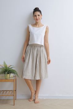 "This Pleated midi skirt is perfect for this summer, Crafted with 100% linen, featuring elasitc high waist and deep pocket, comfy and versatile ★★FEATURES 100% Linen Elastic waist Two side pockets Pleated skirt Regular fit A Line skirt No lining Perfect for Summer, Spring, Autumn ★★ Model Size Height approx 162 cm (5′ 4″) Bust 84 cm (33\") Waist 66 cm (26\") She wears size XS. ★★ Bespoke Order Service If you Request other color Request the length Your height is not between 155 cm- 172 cm Your we Linen Midi-length Pleated Skirt, Beige Midi Skirt With Pockets, White Linen Flared Skirt, White Flared Linen Skirt, Summer Midi-length Pleated Skirt With Pockets, Beige Linen Flared Skirt, Summer Knee-length Linen Skirt, Casual Linen Knee-length Maxi Skirt, Linen Midi Skirt With Lining