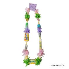 a letter made out of candy and flowers on a white background for a spring festive