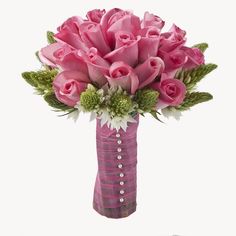 a vase filled with pink roses and greenery