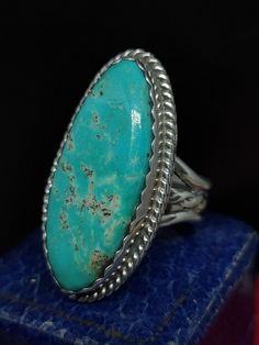 This stunning vintage ring has great style featuring a large natural turquoise gemstone set in sterling silver, the ring has been skillfully crafted by native American silversmiths J R HUSKON.  Face length approx - 36.6 mm UK size - W US size - 11 Message me any questions  ITEM - S1606 Antique Turquoise Sterling Silver Ring, Untreated Southwestern Style Ring Jewelry, Vintage Sterling Silver Turquoise Ring With Large Stone, Antique Untreated Turquoise Jewelry, Vintage Turquoise Ring With Large Oval Stone, Western Style Turquoise Sterling Silver Ring, Western Sterling Silver Gemstone Ring, Western Style Sterling Silver Gemstone Ring, Vintage Oval Turquoise Ring With Large Stone