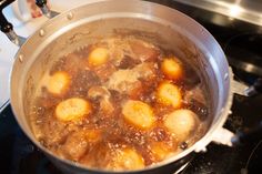 the food is being cooked in the pot on the stove top and ready to be eaten