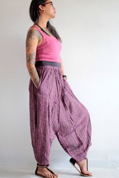 "Beautiful soft cotton fabric. Made into our popular dropcrotch capris pants but this one the crotch is not as low! 2 pieces of leg patch together in an untraditional way. We play around with the pattern and it turns out good! Simple elastic waist. cuff leg.2 super useful pocket on both sides. Very comfortable. Measurement; Waist (elastic) 24-26\" Hip max 36\" Length 33\"" Casual Cotton Drop Crotch Pants, Casual Drop Crotch Cotton Pants, Baggy Cotton Capris With Pockets, Spring Cotton Drop Crotch Harem Pants, Casual Cotton Harem Pants For Yoga, Cotton Drop Crotch Pants With Elastic Waistband, Summer Cotton Harem Capri Pants, Casual Drop Crotch Harem Pants For Loungewear, Summer Harem Pants With Hip Pockets