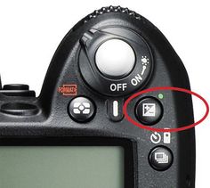 an image of a digital camera with two buttons