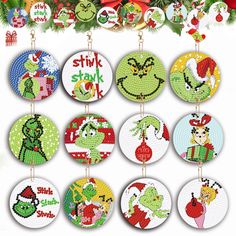 cross stitch christmas ornament kits with the grin's face on each one