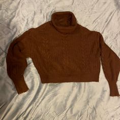 This Is A Very Cute Turtleneck, Cableknit Cropped Sweater, Rich Brown Color, This Tag Says Extra Small, But It’s Very Oversize Could Fit Even Medium I Don’t Take Selfies, But I’m Trying To Show How Cute This Sweater Is It Has So Much Stretch To It Because It’s So Soft. You Can Even Talk It Into Your Jeans If You Want. It’s Gotta Drop Sleeve Cablenet Extra Extra Hi Hi Turtleneck It’s Super Cute. Oversized Soft Knit Top For Cold Weather, Slouchy Chunky Knit Top, Solid Knit Turtleneck Cropped Sweater, Cozy Brown Knitted Top, Fall Cable Knit Turtleneck Tops, Casual Brown Turtleneck Sweater, Cozy Chunky Knit Acrylic Tops, Cozy Acrylic Top, Oversized Turtleneck Knit Cropped Sweater