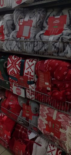 there are many christmas sweaters on display in the store