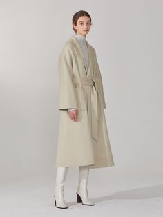 Editor's NotesThis oversized fit raglan sleeve coat made from cashmere wool blend has elegant loose silhouette expressing chic sophisticated mood. The belt helps creating different silhouettes with slender waist line.- Woolmark certified cashmere wool blend- Subtle shine and soft texture- Double layered fabric- Curved shoulder line- Self fabric belt- Reversible design- Side pockets on one side and patch pockets on the other- Notched collarMeasurements(in.)36(S) / 38(M)- Chest: 21.73 in. / 22.76 in.- Neck to Sleeve Length: 28.94 in. / 29.69 in. - Total Length: 45.51 in. / 46.50 in.* Model Info: Height 5' 9.5 , Bust 31.10 in., Waist 22.83 in., Hip 35.04 in. / Fitting size MComposition & Care- 30% Cashmere, 70% Wool- Dry cleaning onlyDesigner- by MUSEE Raglan Sleeve Coat, W Concept, Fabric Belt, Cashmere Wool, Wool Coat, Mens Bottom, Raglan Sleeve, Oversized Fits, Duster Coat