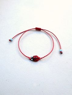 Ladybug bracelet March Bracelet Spring MARTIS Greek Bracelet, Martisor Bracelet, Martaki, Best Friend Gift Ladybird bracelet glass bead The March bracelet is an ancient Greek custom. From the beginning of March, people wear a bracelet made of white and red twisted thread. According to the tradition, the March bracelet protects those from burning of the first sun of spring. The last day of March,the bracelet is left on trees so that swallows can use it for building their nests. Bracelet is made o Nickel Free Round Beads Friendship Bracelet, Round Braided Bracelets With Adjustable Cord As Gift, Adjustable Nickel-free Beaded Bracelet As Gift, Adjustable Nickel Free Beaded Bracelet Gift, Adjustable Friendship Bracelet Gift, Cute Adjustable Bracelets For Gift Making, Adjustable Cord Bracelets As Gifts, Gift Braided Bracelets With Adjustable Cord And Round Beads, Cute Adjustable Friendship Bracelets As Gift