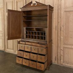 an old wooden cabinet with many drawers