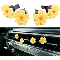 two yellow flowers are attached to the dash board of a car, and one is decorated with black ribbon