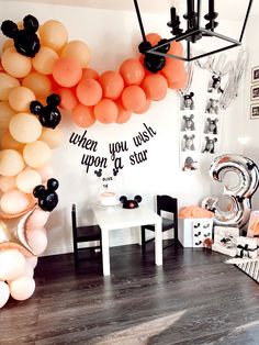 a room filled with balloons and decorations for a birthday or baby's first birthday