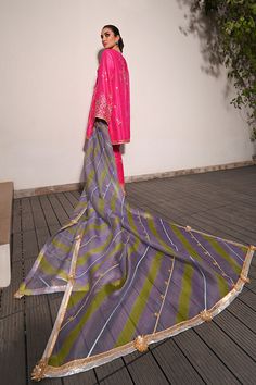 Channeling the old world charm of a kalidar kurta paired with shalwar, Serina is a striking hot pink number cut from pure rawsilk. The undulating trail of the geometric lime green and lavender contrasting organza dupatta hones in the ethereal aura. Model height: 5'3 Length: 38" Cut: relaxed fit In this price range, the Pink Cotton Silk Dupatta With Gota Work, Pink Slub Silk Dupatta For Designer Wear, Purple Silk Kurta With Gota Work, Pink Cotton Silk Sharara With Dupatta, Pista Green Raw Silk Kurta With Sheer Dupatta, Pista Green Cotton Silk Sharara With Sheer Dupatta, Pista Green Slub Silk Dupatta For Eid, Designer Green Tussar Silk Anarkali Set, Designer Pink Tussar Silk Kurta