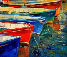 colorful boats are docked in the water