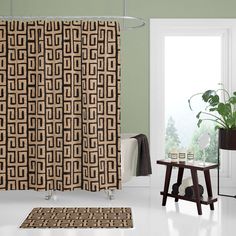 a bathroom with a shower curtain and rug