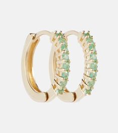 Made from 14kt yellow gold encrusted with emeralds, these huggie-style earrings from Mateo are suitable for pierced ears..Material: 14kt yellow gold.Stone I: emerald.Made in the USA.Designer color name: Yellow Gold.Length 8mm-0.3'.Max. width 2mm-0.1' Gold Stone, Emerald Jewelry, Style Earrings, Pierced Ears, 14kt Gold, Color Names, Prong Setting, Ear Piercings, Round Cut