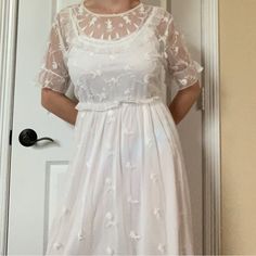 * The Daintiest H&M Rare Sheer White Flowy Midi Dress- Perfect For Flower Picking * A White Slip Dress Attached To A Mesh Lace Drape, Doll Collar, Twirly Skirt And Cinched Sleeves * Never Worn * Size L- True To Size * Usa Shipping Only!! All Sales Final!! * Comment If Needed For Measurements White Feminine Vintage Dress For Summer, Vintage Lace Summer Dress With Short Sleeves, Vintage Lace Dress With Short Sleeves For Summer, Vintage Lace Short Sleeve Summer Dress, Summer Vintage Lace Dress With Short Sleeves, Short Sleeve Lace Vintage Summer Dress, White Midi Vintage Dress For Spring, White Vintage Midi Dress For Spring, Casual White Vintage Dress With Short Sleeves