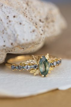 a close up of a ring on top of a rock