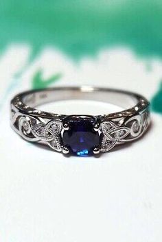 a ring with a blue stone in the middle