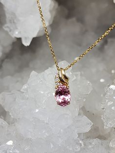 Lovely pink oval cut Tourmaline measuring 8.5x6.5mms set in 14K Gold with 3 natural accent diamonds. Pendant comes with matching 18" 14K Yellow gold chain. Elegant Oval Tourmaline Necklace, Elegant Oval Tourmaline Pendant, Pink Oval 14k Gold Necklace, Oval Yellow Gold Necklace With Accent Stones, Yellow Gold Oval Necklace With Accent Stones, Oval Pink Sapphire In Yellow Gold Jewelry, Oval Pink Sapphire Jewelry With Gemstone Accents, Oval Pink Gold Fine Jewelry, Elegant Oval Tourmaline Gemstones