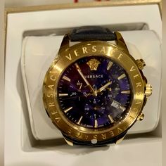 Just Reduced By $200! Luxurious Ip Gold Plated With Chronograph, Navy Blue Face, Navy Blue Leather Strap, Luminous Blue Side Buttons, Sapphire Crystal, Date Window And Water Resistant 50m. Versace Engraved Around The Bezel, Engraved Inside Leather Strap. New In Box W/ Protective Plastic Still On Case. Guaranteed Authentic. Elegant Gold Chronograph Watch With Leather Strap, Luxury Gold Chronograph Watch With Leather, Designer Leather Chronograph Watch For Formal Occasions, Luxury Business Chronograph Watch, Gold Leather Chronograph Watch For Formal Occasions, Designer Chronograph Watch For Formal Occasions, Designer Leather Chronograph Watch Analog, Designer Gold Watches With Leather Strap, Luxury Chronograph Watch