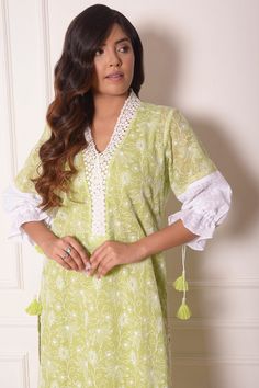 Green kota doriya kurta with floral embroidery and puff sleeves. Paired with lace hem pant.
Component: 2
Pattern: Embroidered
Type Of Work: Thread work, Lace work
Neckline: V neck
Sleeve Type: Puff sleeves
Fabric: Kota Doriya, Chanderi
Color: Green
Other Details: 
Pintuck hem pant
Lace work neckline and kurta hem
Tassel detail cuffs
Occasion: Mehendi and Haldi - Aza Fashions Traditional Cotton Silk Salwar Kameez With Embroidered Sleeves, Unstitched Kurta With Embroidered Sleeves For Navratri, Cotton Anarkali Sets With Embroidered Sleeves, Navratri Straight Kurta Sets With Embroidered Sleeves, Traditional Navratri Kurta With Embroidered Sleeves, Traditional Embroidered Kurta For Navratri, Designer Wear Sets With Embroidered Sleeves For Navratri, Unstitched Cotton Silk Kurta With Embroidered Sleeves, Designer Green Kurta With Embroidered Sleeves