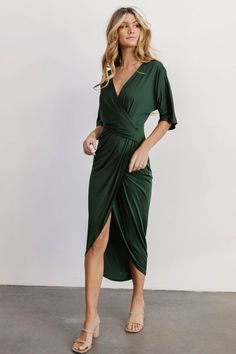 This stunning hunter green ruched midi dress features flattering pleating, kimono style sleeves, and a body-con design with stretch material. Short Sleeve Stretch Dress For Brunch, Fitted V-neck Maxi Dress With Draped Sleeves, Stretch Short Sleeve Dresses For Brunch, Chic Green Fitted V-neck Dress, Fitted V-neck Flattering Maxi Dress, Green Fitted V-neck Dress With Short Sleeves, Elegant V-neck Bodycon Dress For Brunch, Elegant Green Midi Dress With Surplice Neckline, Green Midi Dress With Surplice Neckline For Date Night