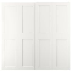 an open white door with three doors on one side and four panels on the other