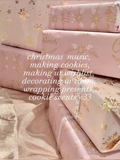 three pink boxes stacked on top of each other with the words christmas music making cookies