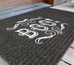 a door mat with the word boo written on it