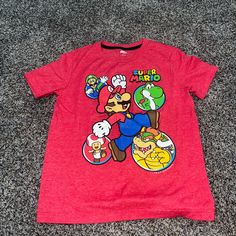 Old Navy Short Sleeve Tee Shirt Red With Mario Brothers Graphic Size Small Brand New Never Worn Red Crew Neck Tops Casual Style, Fun Red Top With Cartoon Print, Cute Red Crew Neck Shirt, Fun Red Crew Neck Tops, Fun Red Cotton Tops, Red Crew Neck Shirt, Cute Style, Fun Red Shirt With Cartoon Print, Red Cotton Top With Cartoon Print, Red Short Sleeve Tops With Character Print