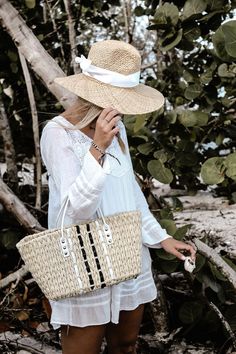 Straw panama hat with a white grosgrain tie. Made of natural straw, The Everywhere Hat has a wide brim that protects you from the sun while looking casual and modern. The adjustable grosgrain ribbon can be custom tied for a perfect fit to your head size, plus it adds the perfectly sweet accent to pair with breezy outfits for a stylish sunny look. Content:- Raffia Straw- Imported Size:- One Size Fits All, Adjustable- Crown: 5.5"- Brim: 4" Straw Panama Hat, Breezy Outfit, Custom Ties, Summer Look, Wide Brimmed, Straw Hat, Grosgrain Ribbon, Your Head, Summer Looks