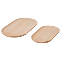 two wooden plates sitting next to each other