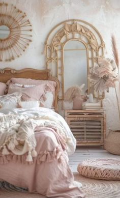 a bed room with a neatly made bed and a mirror on the wall above it