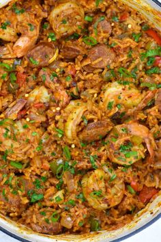 a large pot filled with rice and shrimp